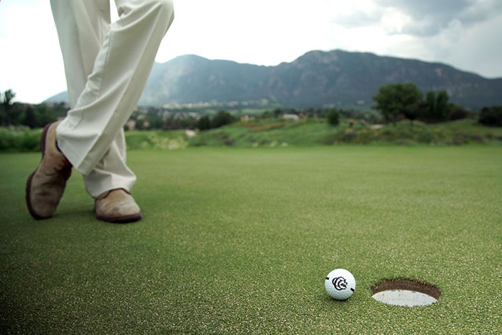 Golf ball at hole's edge